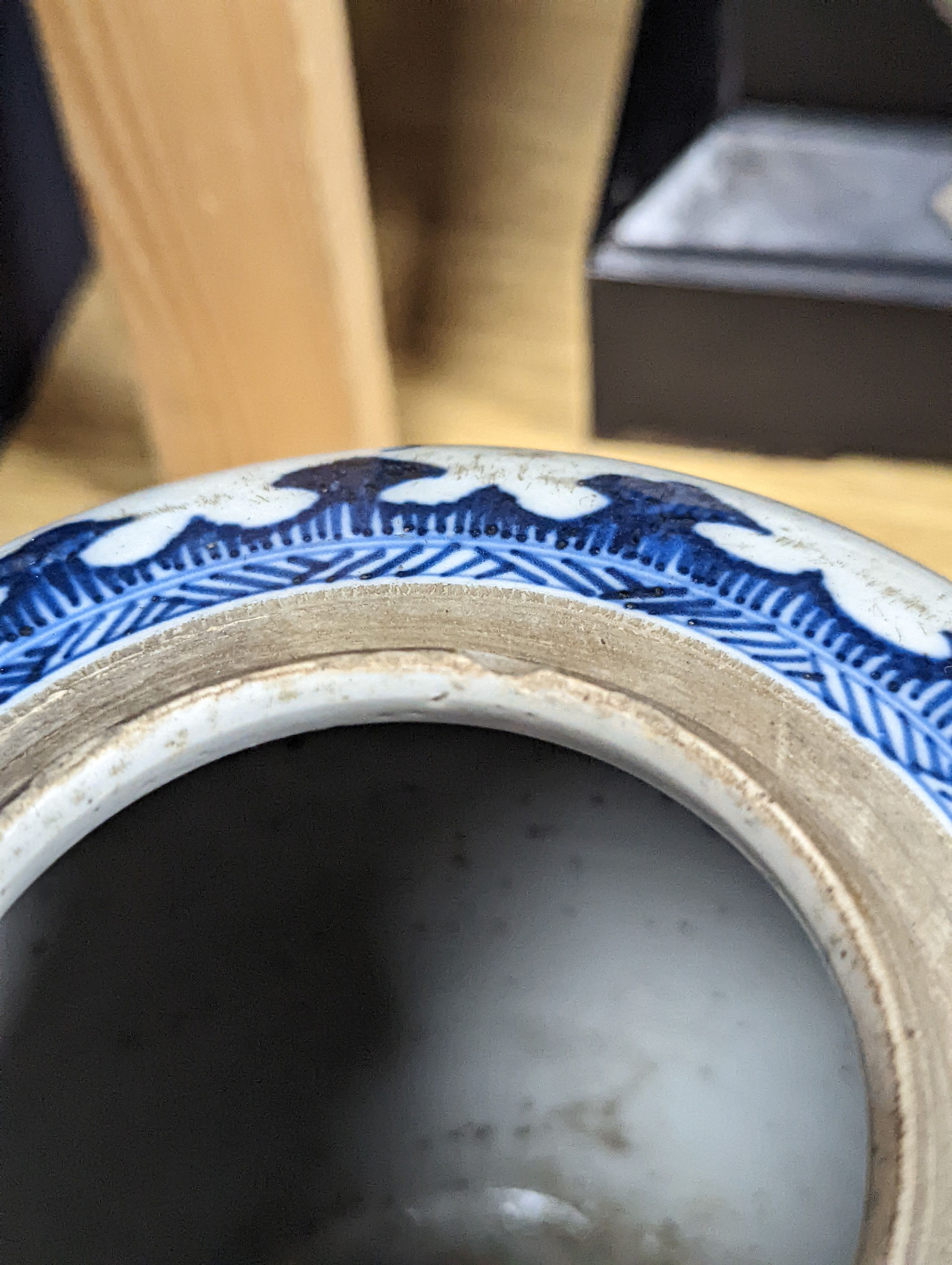 A 18th/19th century Chinese blue and white jar and wood cover - 22cm high